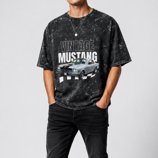 Person wearing a black 'Vintage Mustang' t-shirt and black jeans on a white background