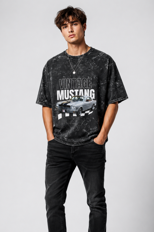 Person wearing a black 'Vintage Mustang' t-shirt and black jeans on a white background